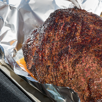 A brisket wrapped in an aluminum foil