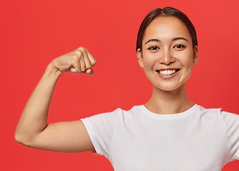 Fit healthy woman flexes hand