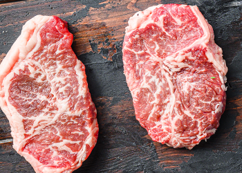 Blade steak on a wooden surface