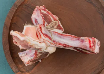 Lamb meat top view on wooden cutting board