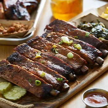 Fresh St Louis Style Cut Ribs on wooden cutting board