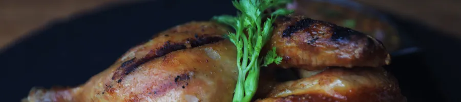 Close up image of a grilled chicken thighs