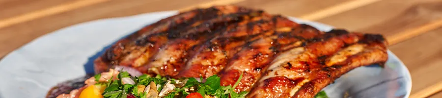 One serving of a baby back rib dish