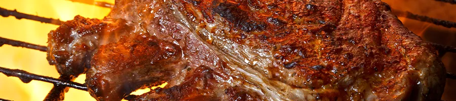 Close up image of pork ribs on grill