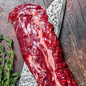 Hanger steak on top of knife