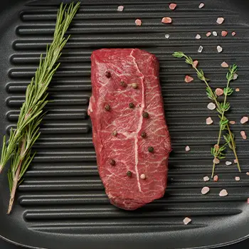 Top blade steak on top of grill pan