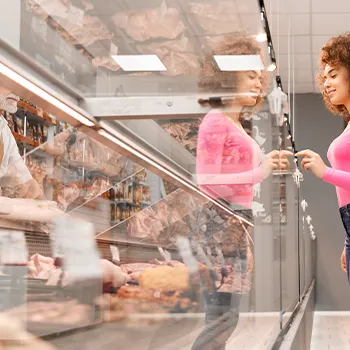 Woman choosing what meat to buy