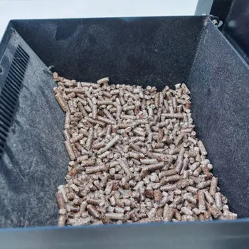 A smoker hopper filled with wood pellets