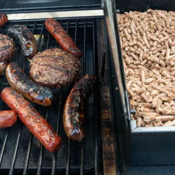 Grilling using a pellet smoker. Pellets and meats