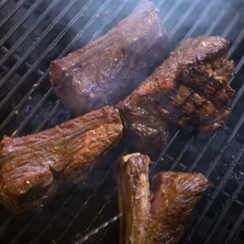 Close up image of freshly cooked ribs on grill