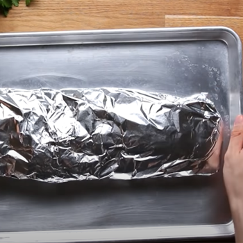 Beef ribs in covered in aluminum foil