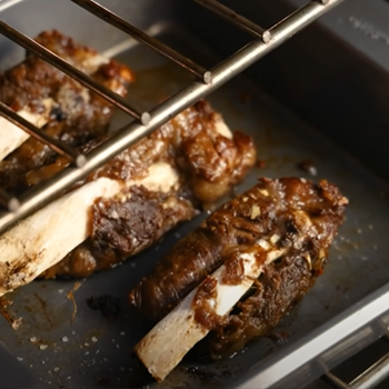 Beef ribs inside the oven close up image