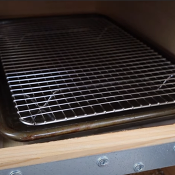 An empty drip pan on drawer