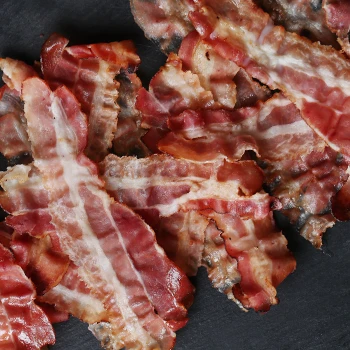 Top view of freshly fried bacon