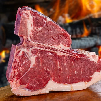 A T-Bone on cutting board with fire