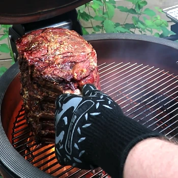 Grilling a big meat using a barbeque glove