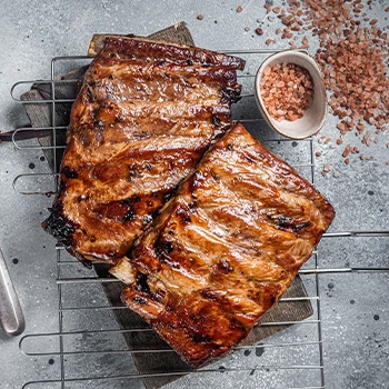 Top view of ribs resting on a grill