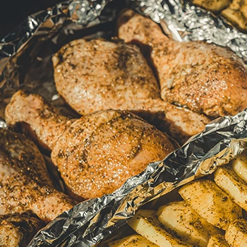 Chicken legs covered in foil grilled in oven