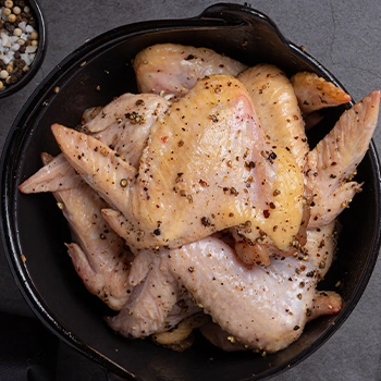 Marinated chicken on pan top view