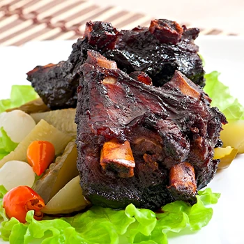 Close up image of a beef ribs cut on plate