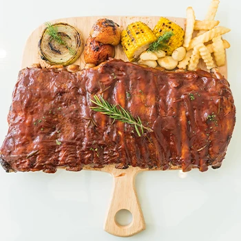 Pork rib on wooden cutting board