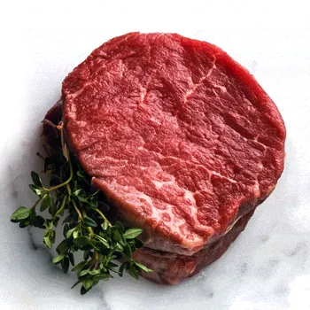 Raw Filet Mignon on plain background