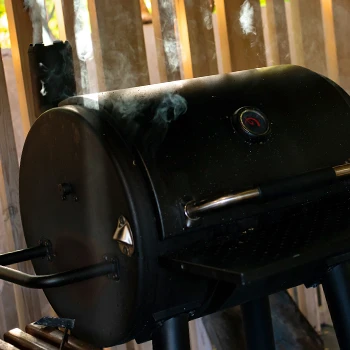 Closed lid of a charcoal grill smoker