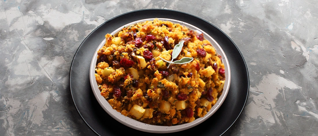 Sausage Cranberry and Cornbread Stuffing on a black and white plate