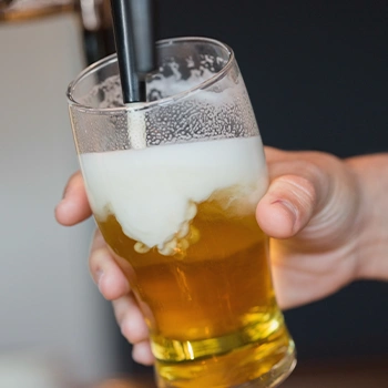 Filling a glass with beer