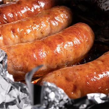 foil with cooked sausages