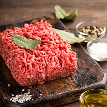 fresh ground chuck on a chopping board