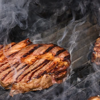 cooking meat in a smoker