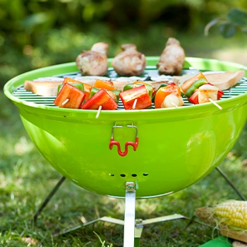 A green portable cooking grill