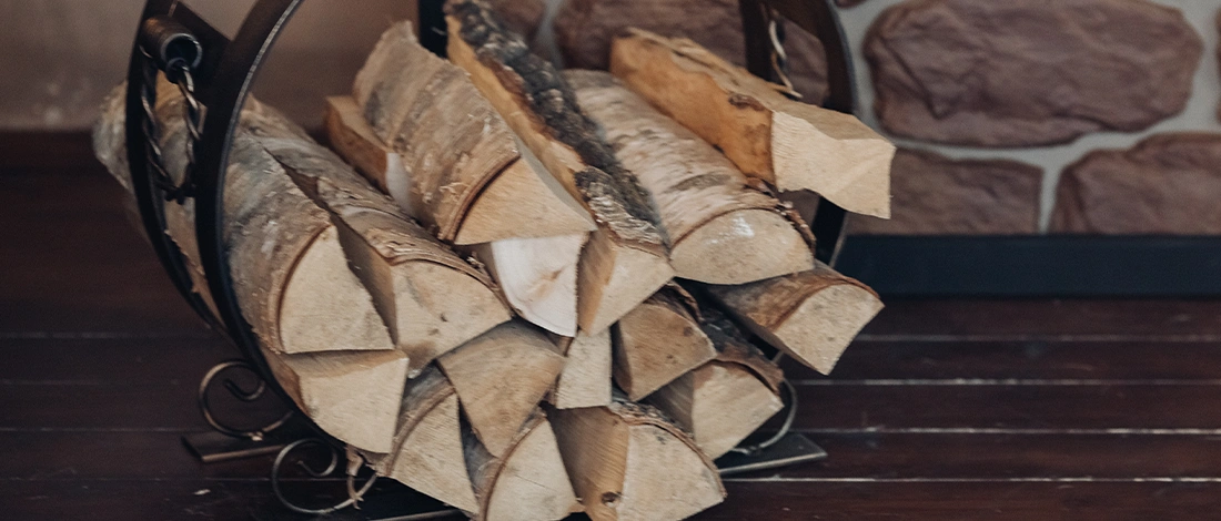 Wood logs inside a metallic holder
