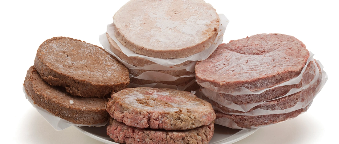 Frozen patties in isolated white background