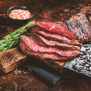 Steak cut up on table