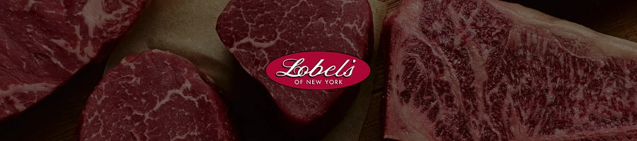 Top view of Lobel's Steak meats with logo overlay