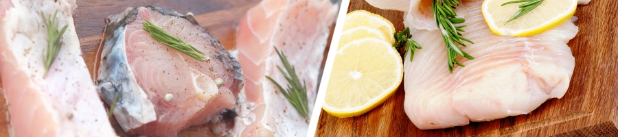 Raw Cod fish with lemon slices on top of cutting board