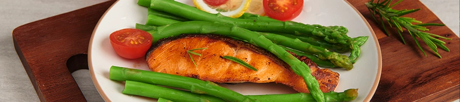 Freshly smoked salmon on plate with vegetables