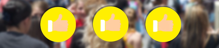 three yellow thumbs-up icons and a blurred crown on the background