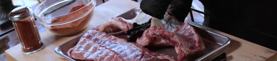 Removing the silverskin away from the baby back ribs