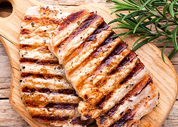 Resting pork chops on cutting board