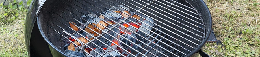 A well lit charcoal grill
