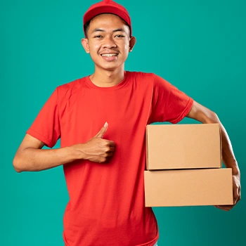 thumbs up from a delivery guy holding boxes