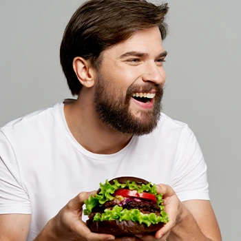 man happily eating