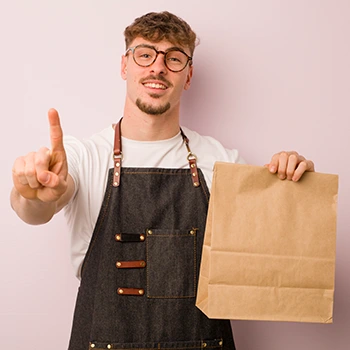 man handing out food