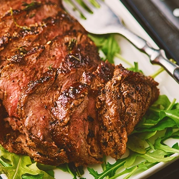 close up cooked chuck steak with vegetables