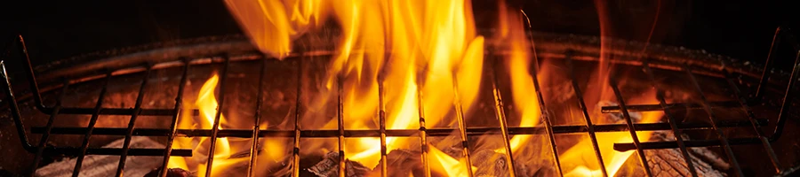 A charcoal grill with high flame