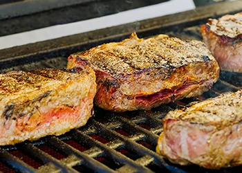 Close up image of grilling meats