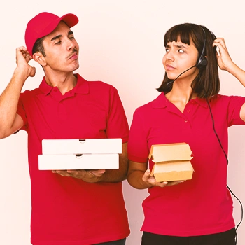 Two persons looking at each other scratching their heads and holding food boxes